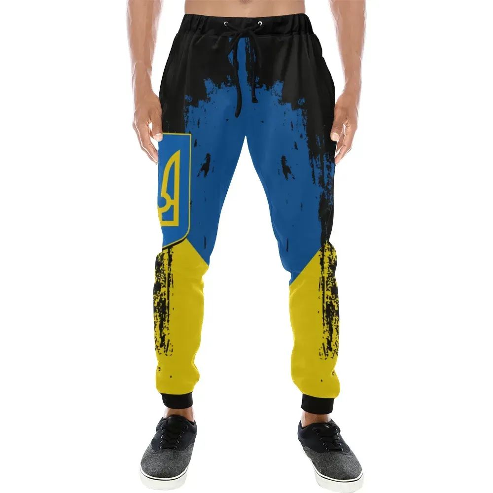 Colorful sweatpants: black waistband, blue front panel, yellow splatter sides