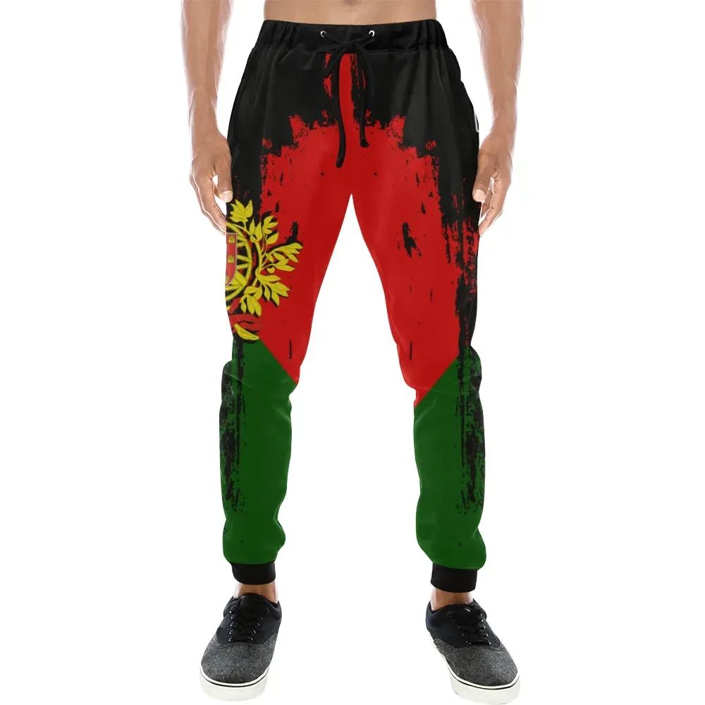 Black drawstring sweatpants with red and green front splatter graphic, cuffed legs