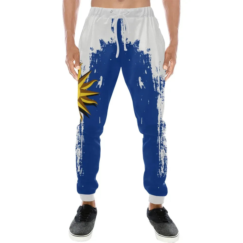 White jogger sweatpants with blue splatter print and yellow burst on left thigh
