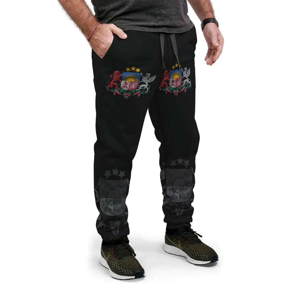 Black jogger pants with multicolor crest graphic, drawstring waist and tapered cuffs