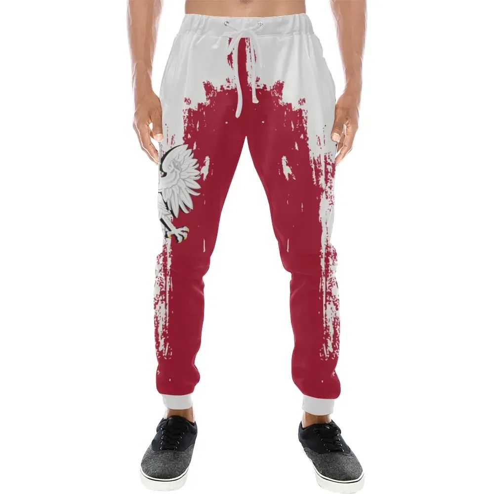 White sweatpants with red splatter graphic and elastic cuffs; front eagle emblem
