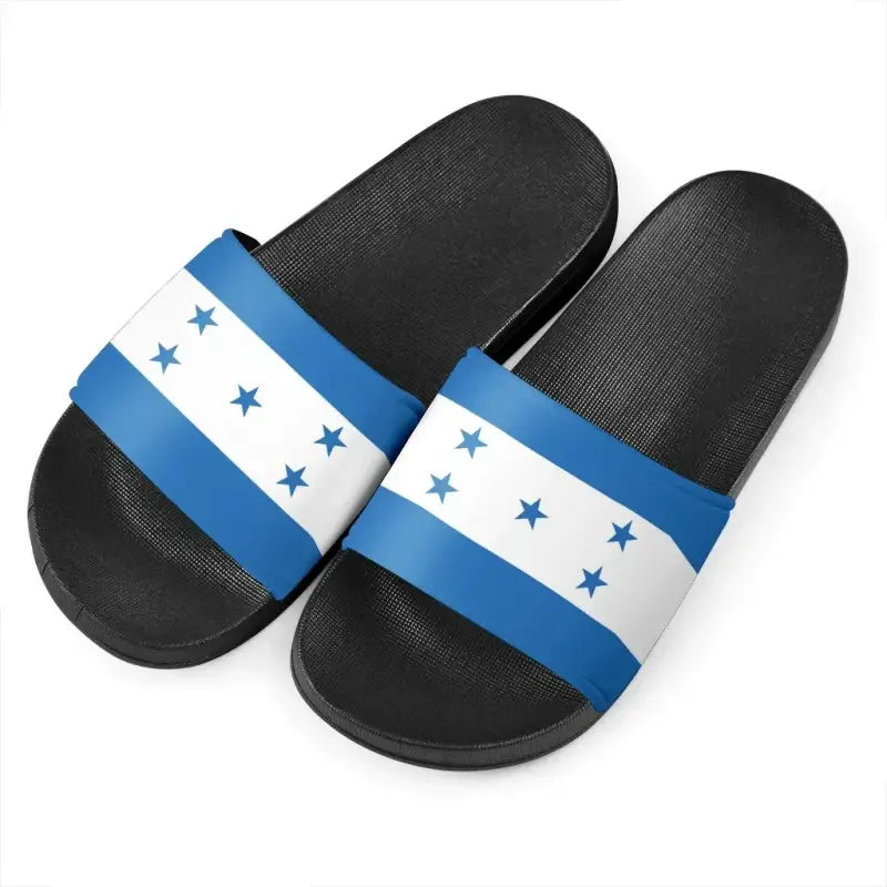 Two black Honduras flag slide sandals with blue-and-white star band across the strap