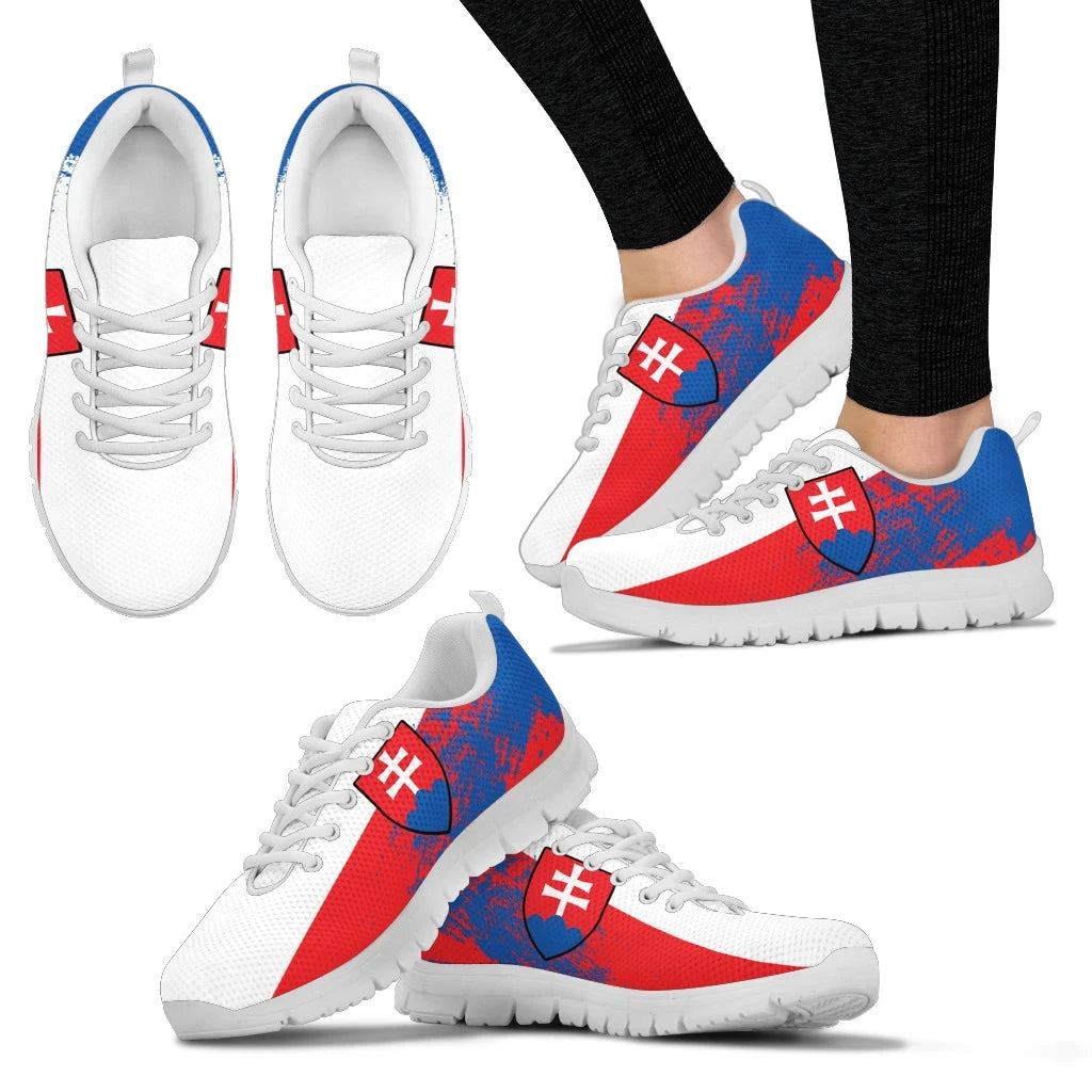 Flag-pattern low-top sneakers, white uppers, blue/red badges, white laces, white sole