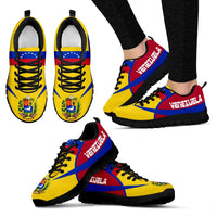 Venezuela sneakers with black sole, yellow-blue-red uppers, lace-up, angled side view