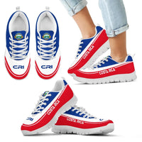 Costa Rica sneakers with jeans, white upper, blue laces, red side stripe, white sole