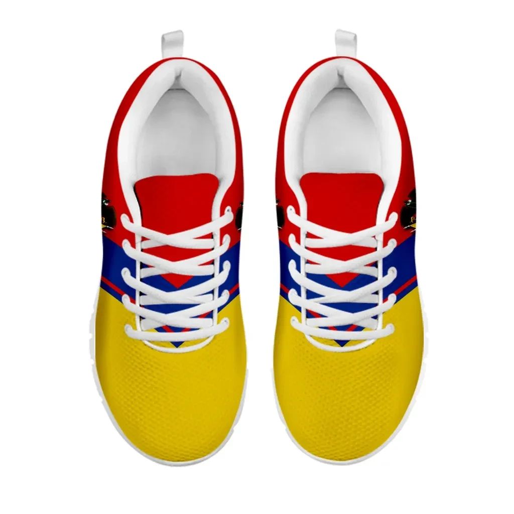 Colombia Rising sneakers pair view, yellow uppers with blue-red accents and white laces