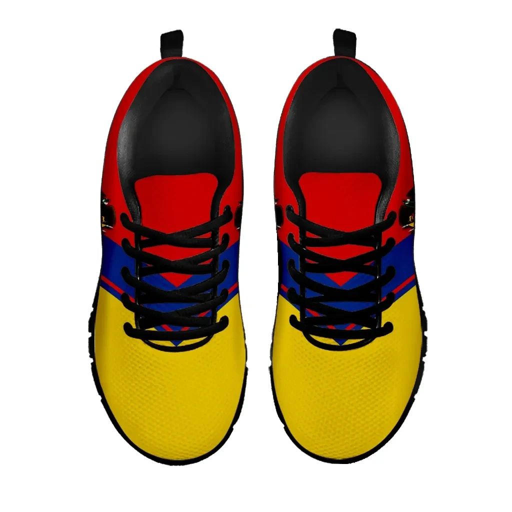 Colombia Rising sneakers pair view, yellow uppers with blue-red accents and black laces