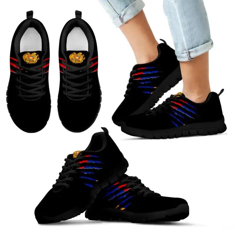 Black-soled sneakers with Armenia crest, blue/red stripe laces and lace-up detail