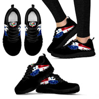 Black low-top sneakers featuring red-blue wing graphic and black textured outsole