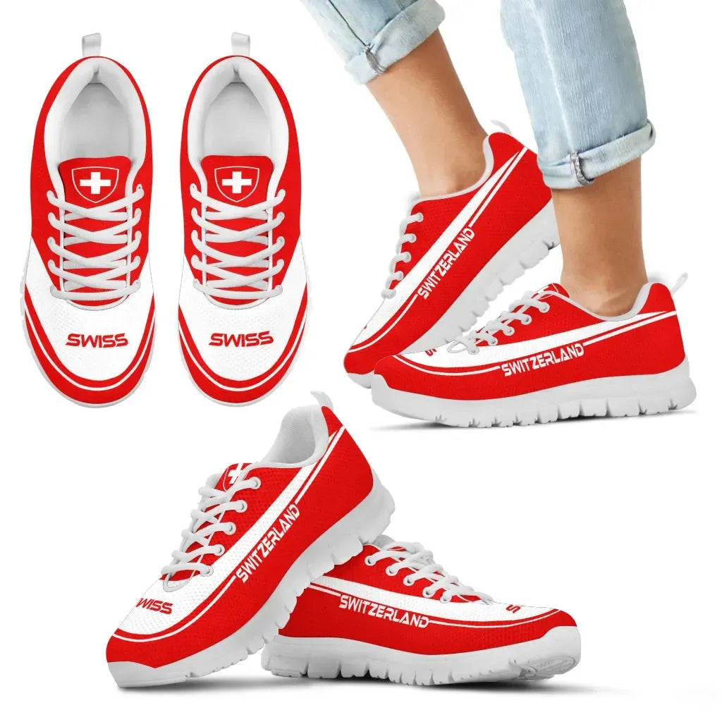 Red-and-white sneakers with Swiss cross emblem and "SWITZERLAND" side text, worn