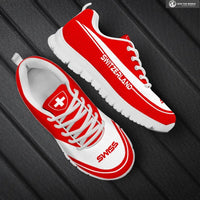 Red Switzerland logo sneakers with white laces and white sole, side view