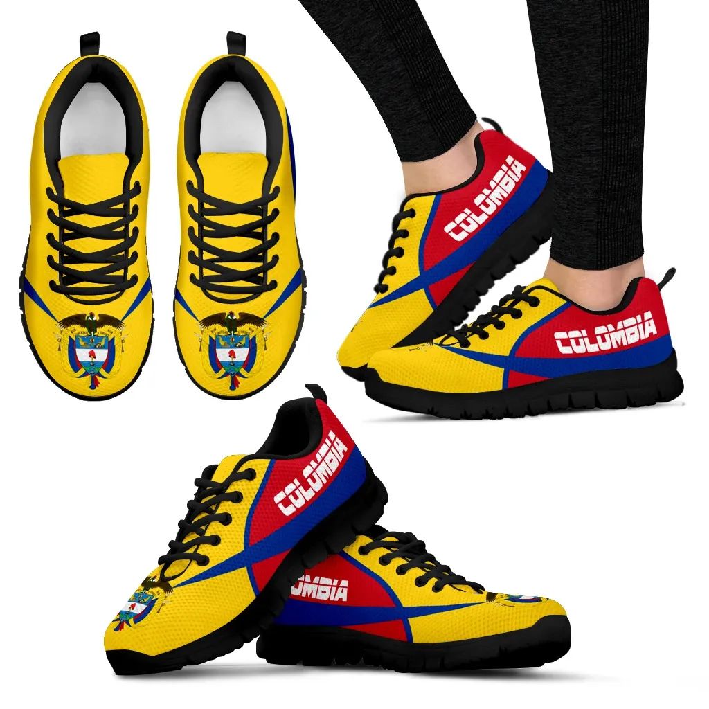 Colombia active sneakers pair on feet, yellow upper with red/blue accents, black rubber sole.