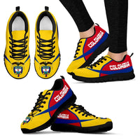 Colombia active sneakers pair on feet, yellow upper with red/blue accents, black rubber sole.