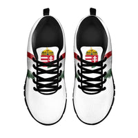 White sneakers with Hungary emblem near laces and wing print, black laces