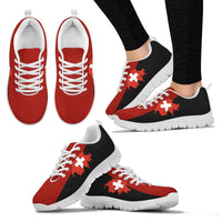 White outsole Swiss map cross sneakers, red toe and black side panel, on feet