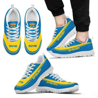 Wearing Sweden sneakers in blue and yellow, white laces, white sole, front and side
