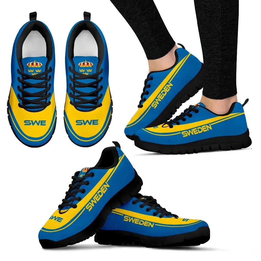 Sweden sneakers blue and yellow with black laces, black soles, worn with pants