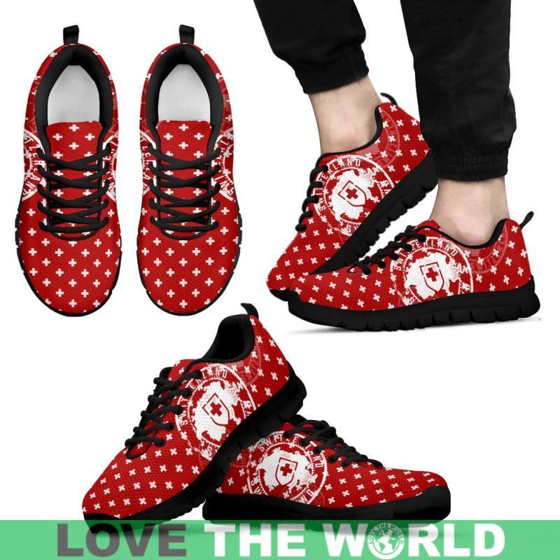 Red Swiss-cross sneakers with black sole, white laces and patterned cross fabric