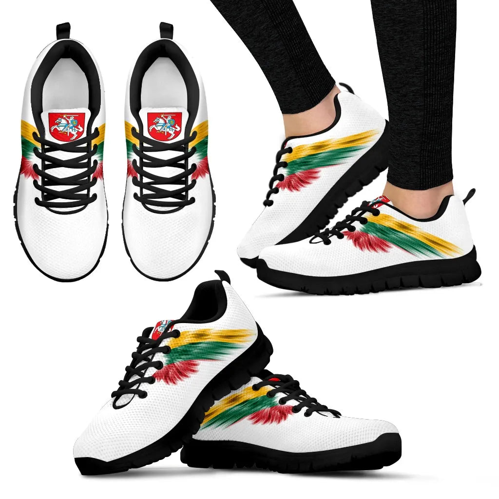 Side view of white sneakers with black sole, black laces, multicolor wing graphic.