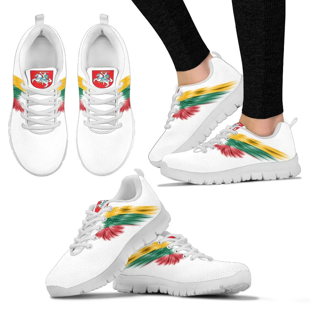 Side view of white sneakers with white sole, white laces, multicolor wing graphic.
