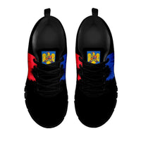 Black sneakers with crest detail on tongue and black laces