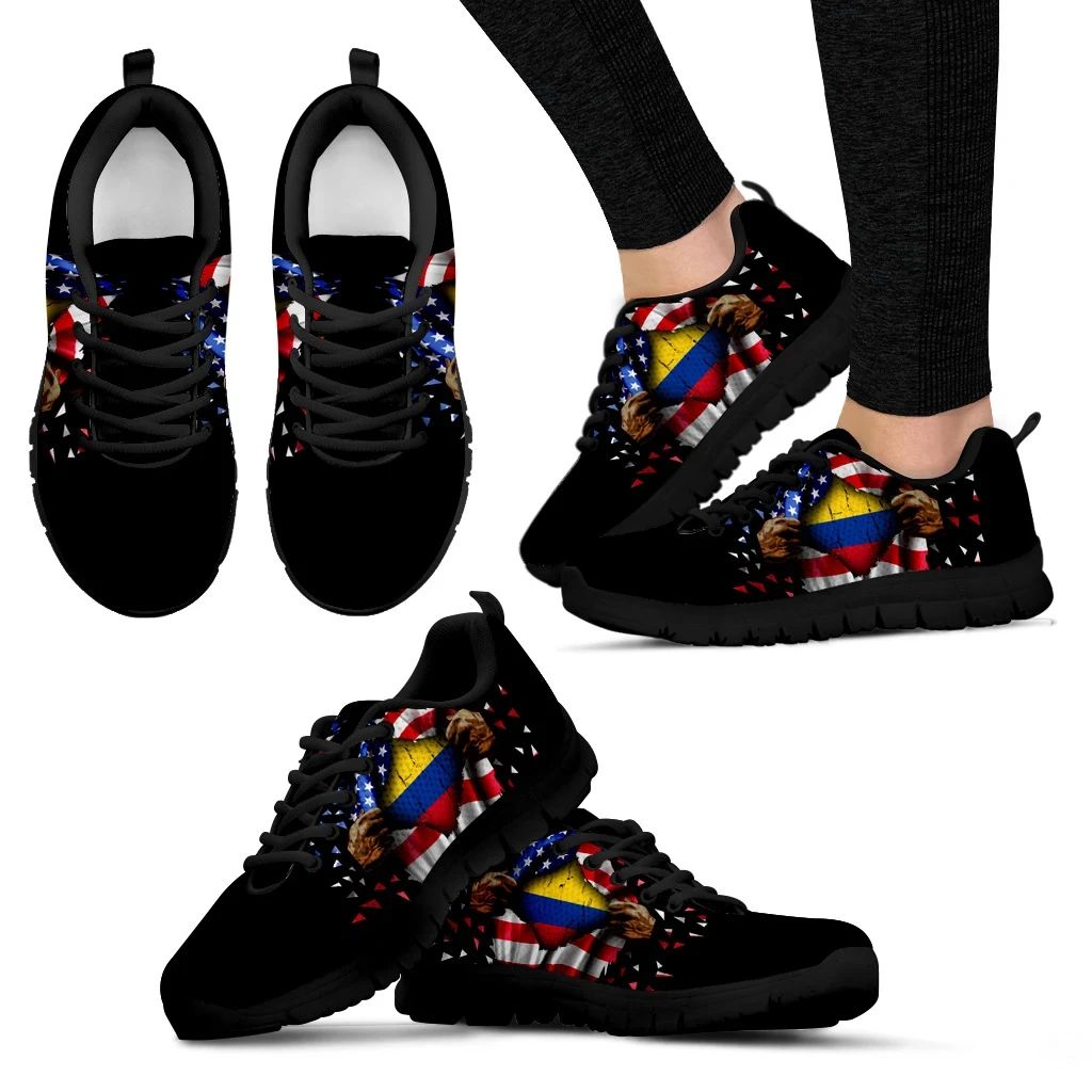 Front view of black sneakers with open hand Colombia flag print, black laces