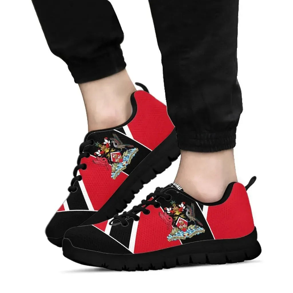 Red and black Trinidad sneakers on feet, black laces, crest emblem, chunky black sole