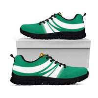 Green and white low-top sneakers with diagonal stripes; black tread sole
