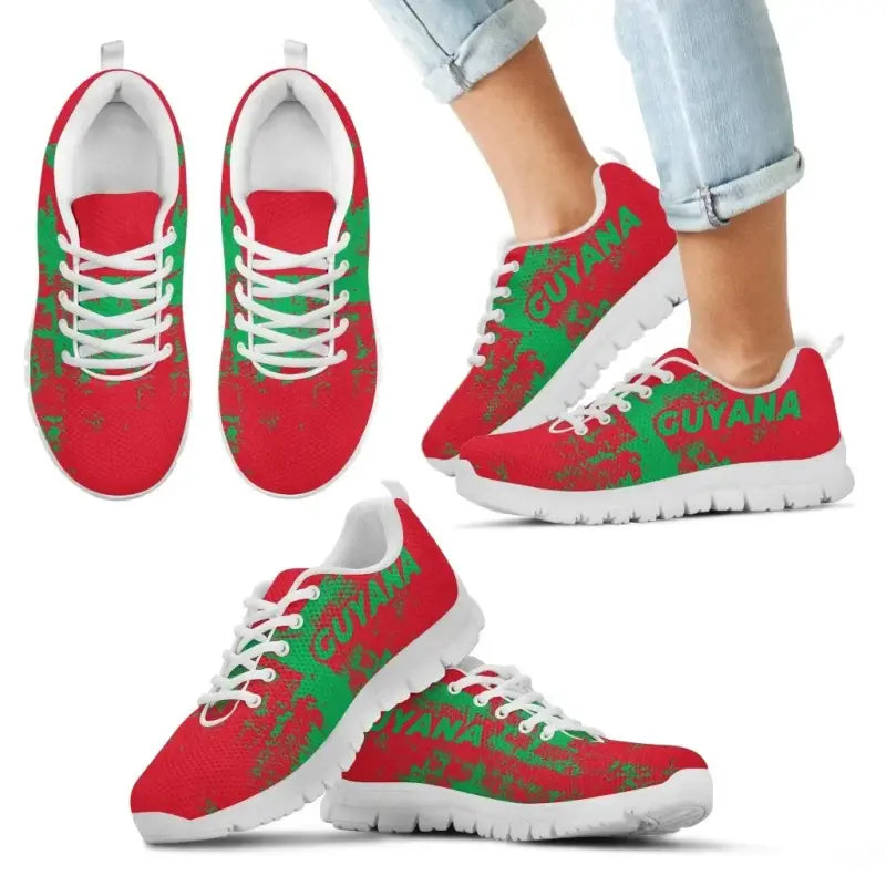 Guyana smudge-style sneakers, red with green “GUYANA” print, white laces, white sole