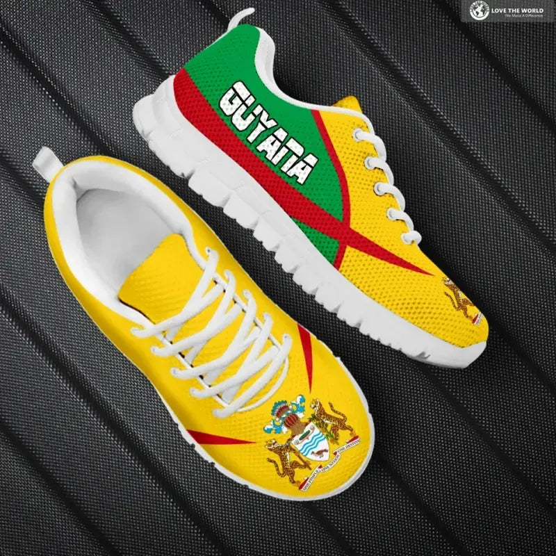 Active sneakers, yellow with green/red design, white sole, lace-up close view