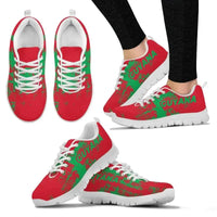 Guyana smudge sneakers pair, red with green “GUYANA” print, white laces, white sole