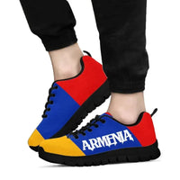 Armenia flag sneakers on feet, blue red yellow color blocks, black textured sole