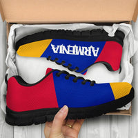 Sneakers box contents: blue/red/yellow Armenia flag uppers, black sole, “ARMENIA” logo