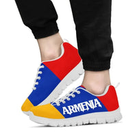 Armenia flag sneakers worn with black pants, blue red yellow, “ARMENIA” on side