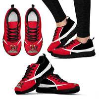 Red and black active sneakers with black sole, white stripe, and crest on toe