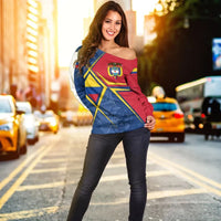 Off-shoulder sweater in red, blue, yellow; Colombia crest print