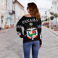 Black off-shoulder sweater, back view with PANAMA text and crest emblem