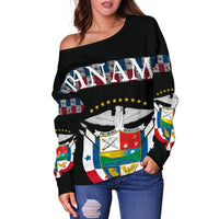 Black off-shoulder sweater with PANAMA text, crest emblem, and colorful flag blocks