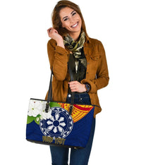 Blue tote front view with wheel graphic, floral decoration, 'YOUR TEXT' print, black zipper