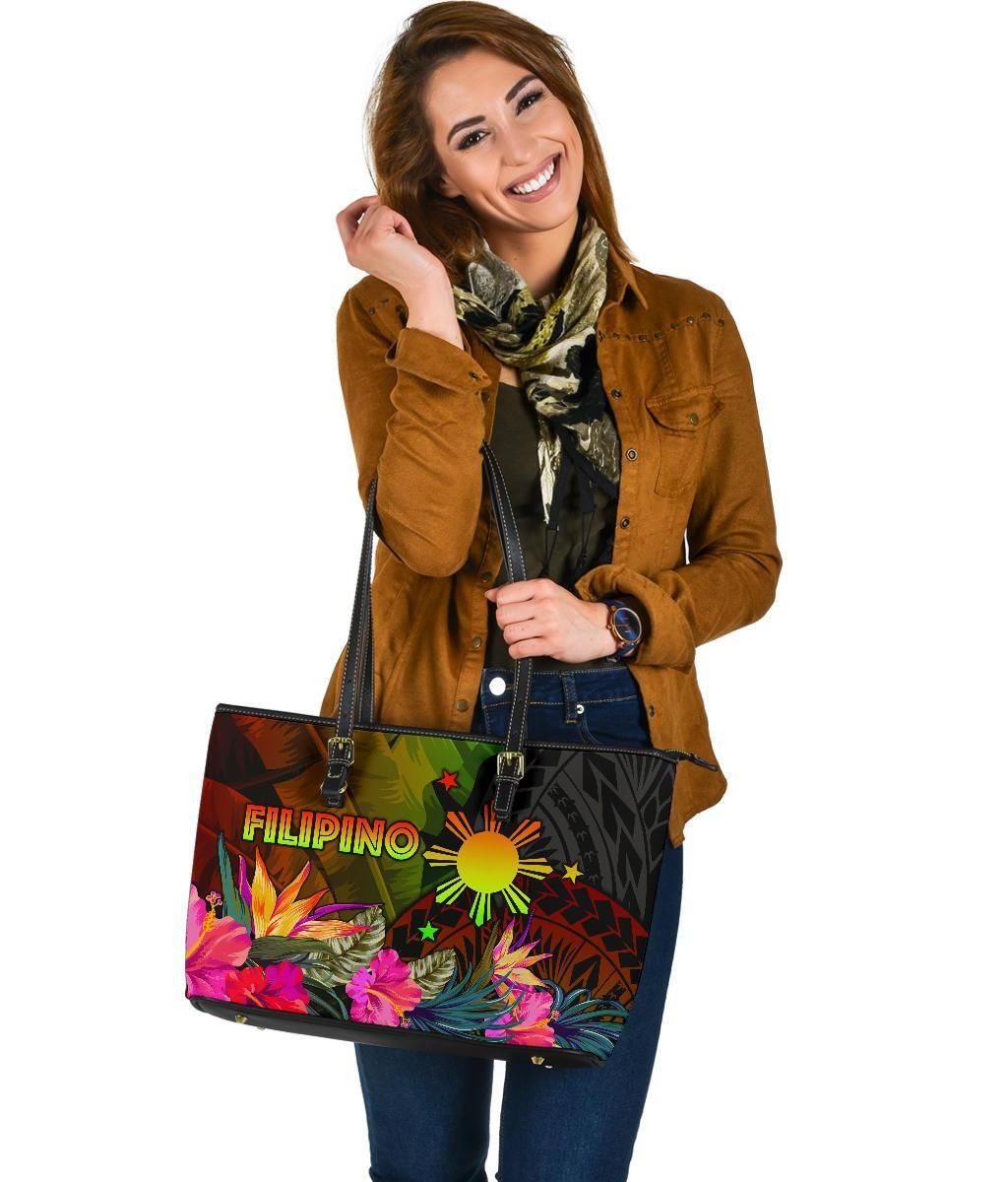 Colorful printed tote bag with black dual handles, FILIPINO text and tropical flowers