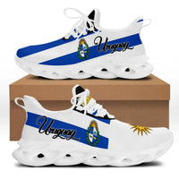 Clunky low-top sneakers with blue-and-white Uruguay stripe graphic, white sole and eyelets