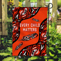 Orange Every Child Matters garden flag with black-red pattern and feather graphic
