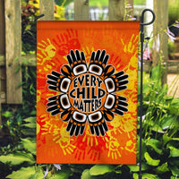 Orange yard flag with bold “Every Child Matters” text and handprint sunburst design