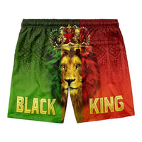 Black King lion shorts, green/red with crown over lion face and “BLACK KING” lettering