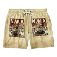 Men's yellow drawstring shorts with N.W.A graphic front panels