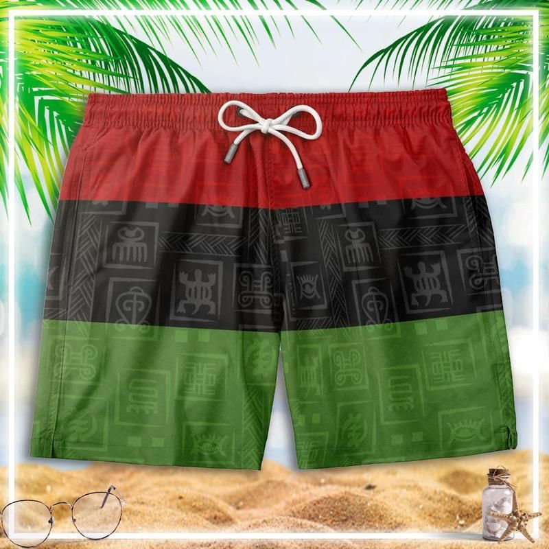 Color-block swim shorts with elastic waistband, drawstring, and red-black-green panel design