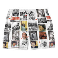 Graphic men’s shorts, multicolor photo prints and red/black blocks; yellow panel detail