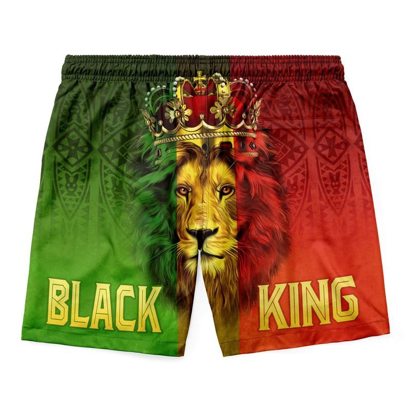 Green/red lion king shorts with drawstring; yellow “BLACK” on left and “KING” on right