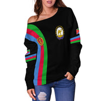 Black off-shoulder sweatshirt with green-blue-red vertical stripe and gold crest