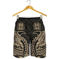 Black men’s shorts hanging on wooden hanger, beige tribal print, elastic waist